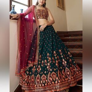 Dark green, pink and orange lehenga.